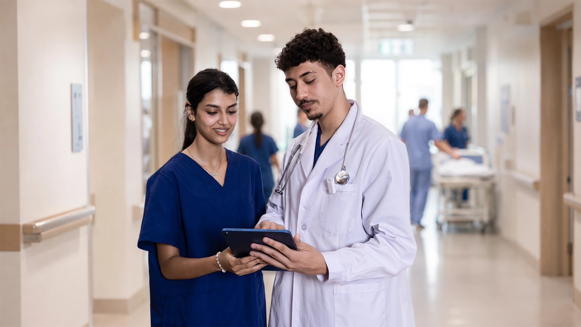 Two clinicians reviewing a patient visit together