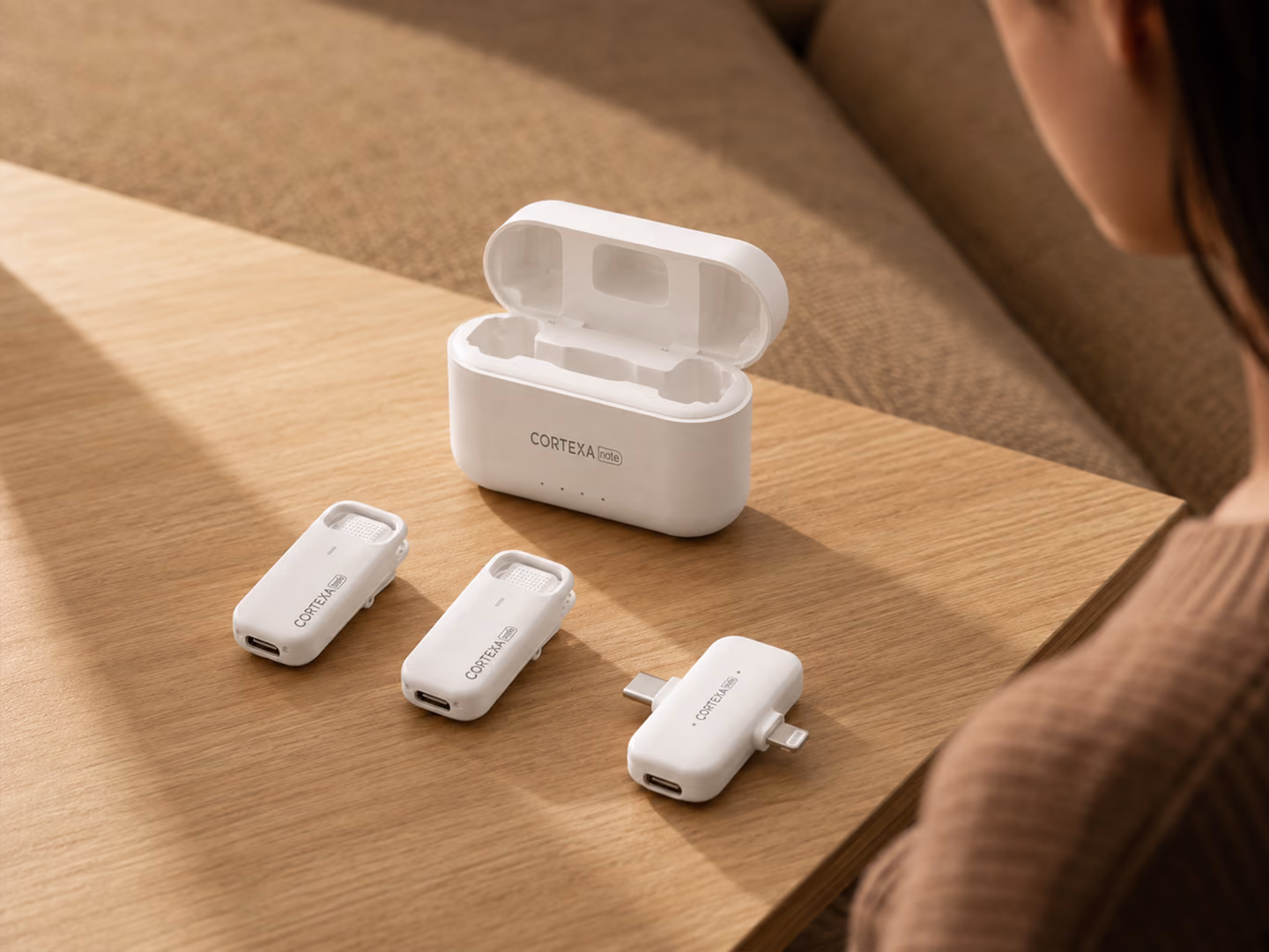Two R1 microphones, the Lightning and USB-C receiver, and charging case