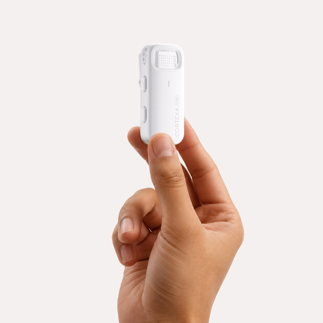 A hand holding the lightweight Cortexa Note R1 microphone